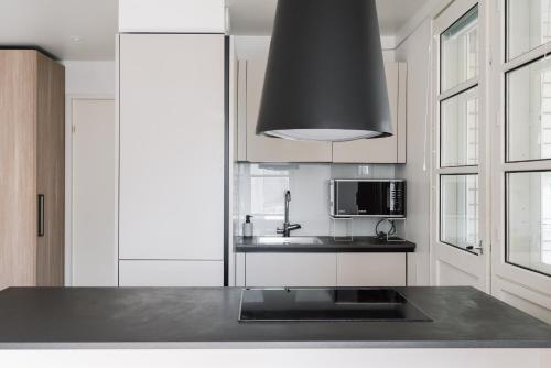 Kitchen, 1BR City Apartment with Balcony Next to the Sea in Vantaa