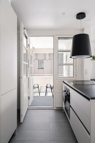 Kitchen, 1BR City Apartment with Balcony Next to the Sea in Vantaa