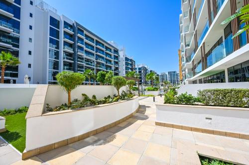 View, Discover a cozy luxury studio with a refreshing pool, just a 10-minute journey from the city's heart in Nad Al Sheba