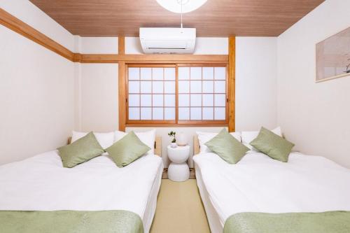 真 Private accommodation with sauna, close to USJ and Expo Park, free parking, 4 bedrooms, 8 beds, 2 bathrooms, Ósaka (fotografie 7)