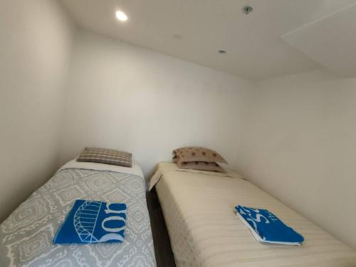 3 Double Beds and 1 Single Bed and 2 Double Sofa Beds in a small 2 Bedrooms Penthouse, Auckland (fotografie 8)