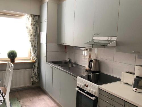 Talo Kainuun korvessa Kiekinkoskella in คูลห์โม