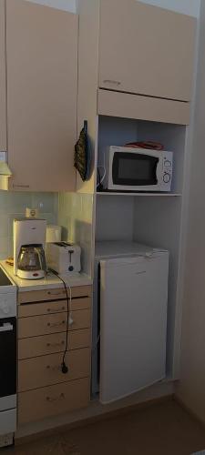 Talo Kainuun korvessa Kiekinkoskella in คูลห์โม