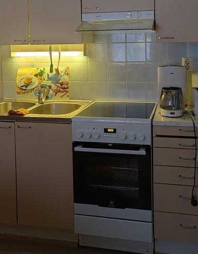 Talo Kainuun korvessa Kiekinkoskella in คูลห์โม