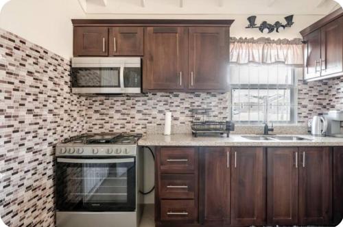 Barefoot Bliss Short Term Rental with pool in Colbeck Manor in Claremont