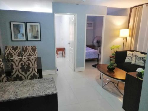Royale 2BR Condo unit with free WiFi near Robinsons Place Imus