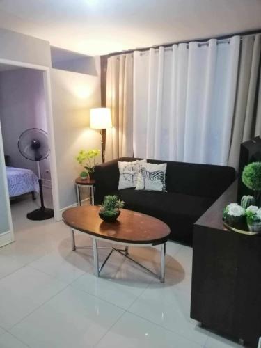 Royale 2BR Condo unit with free WiFi near Robinsons Place Imus