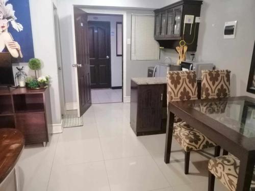 Royale 2BR Condo unit with free WiFi near Robinsons Place Imus