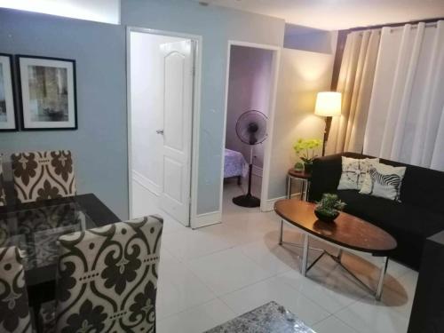Royale 2BR Condo unit with free WiFi near Robinsons Place Imus
