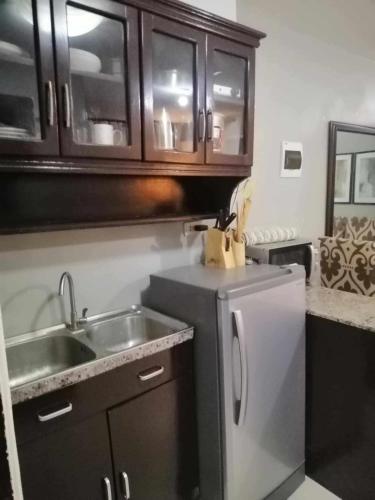 Royale 2BR Condo unit with free WiFi near Robinsons Place Imus