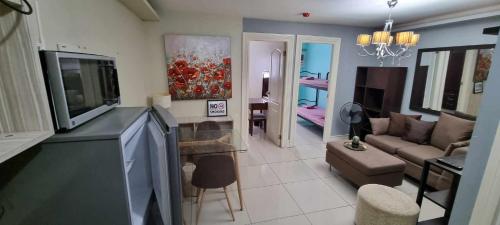 Elegant 2BR Condo unit with free WiFi near Robinsons Place Imus