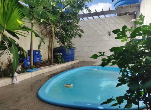 . Casa com piscina e ar condicionado