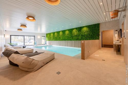 Sous la Houlette, Suites, Piscine intérieure et Sauna chambre d'hôte Lambiernoux