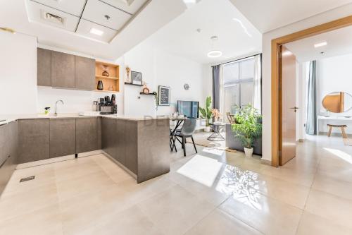 Balcony Offering Community Views 1BR with Assistant Room, Walking Distance to Community Park , Pantheon Elysee , Jumeirah Village Circle by Deluxe Holiday Homes, Dubai (photo 2)