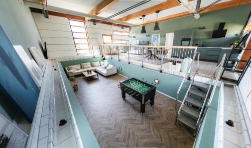 Közös társalgó / TV, Die Badeanstalt I Loft Nürnberg I 5 Minuten zu Fuß zum kostenlosen Naturbad I Messenähe I Waldnähe (Die Badeanstalt I Loft Nurnberg I 5 Minuten zu Fuß zum kostenlosen Naturbad I Messenahe I Waldnahe) in Postbauer-Heng