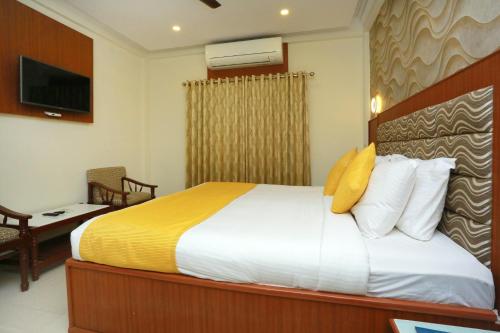Deluxe Triple Room room in Super Capital O Kovilakam Residency