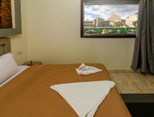 Enjoy with NEFERTIT pyramids view