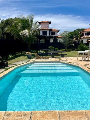 수영장, Suites em Condominio com Piscina 150 mt Manguinhos in 매그후인호스 비치