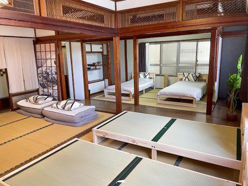 大家族旅行 広々独立した2フロア完全貸切最大15名 国際通り徒歩1分 2台駐車場無料 リラックスした雰囲気 Paradise inn 安里, Naha (fotografie 8)