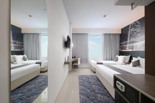 Family Room room in Hotel Neo Candi Simpang Lima - Semarang by ASTON