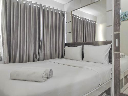 Best Deal and Cozy 2BR Vida View Apartment By Travelio