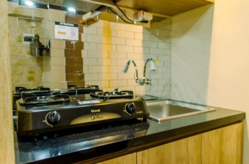 virtuvė, Homey and Simply 2BR at Cinere Resort Apartment By Travelio in Sukmajaya