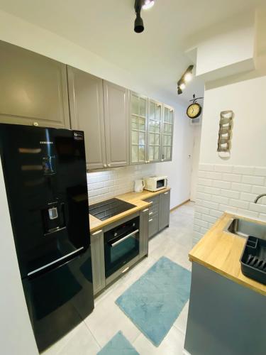 Przytulny apartament z tarasem in Ольштинек