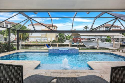 Four-Bedroom House room in Sunsation on the Water! - Walk To Vanderbilt Beach! Salt Water Pool!