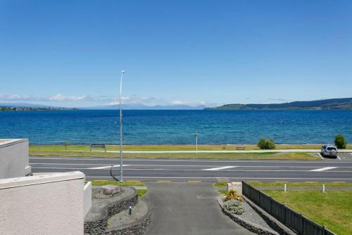 Lakefront Living, 3-Level Home With Spectacular Water and Mountain Views