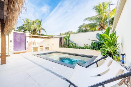 Maison balinaise avec piscine chauffée, four à pizza - Location saisonnière - Saint-Louis