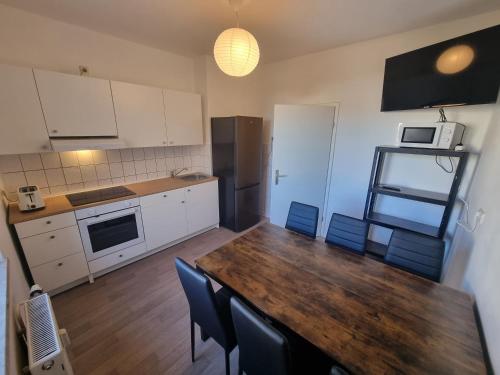 sala de TV, UPSIDE Living - Apartment für Monteure (UPSIDE Living - Apartment fur Monteure) in Merseburg