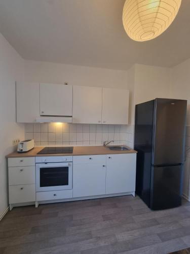 Cocina, UPSIDE Living - Apartment für Monteure (UPSIDE Living - Apartment fur Monteure) in Merseburg