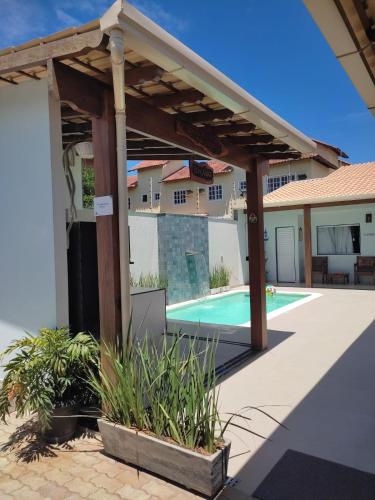 Swimming pool, ESPACO PEROLA GUANABARA, 70 Metros do Mar, 4 Suites independentes COM AR, Area Gourmet Integrada com in Anchieta