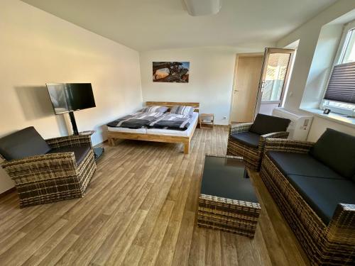 ห้องส่วนกลางสำหรับนั่งเล่น/ดูทีวี, Ferienwohnung Gerdi in ฮอยเอิร์สแวร์ดา