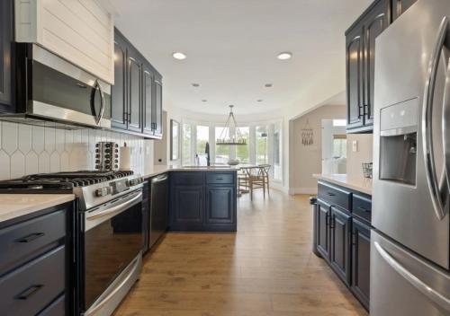 Modern Charm with Rare Flat Lot Dock Game Area in Winchester 