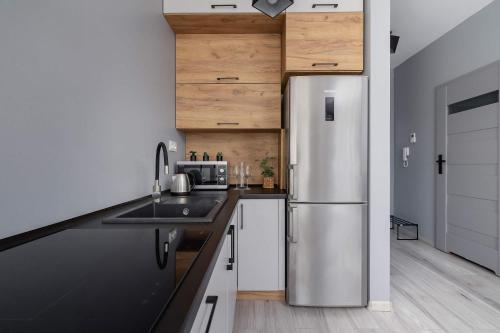 Cocina, Partyzantów Monochrome & Modern Studio in Sosnowiec by Noclegi Renters (Partyzantow Monochrome & Modern Studio in Sosnowiec by Noclegi Renters) in Sosnowiec