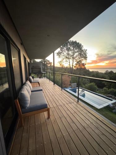 balkon/terras, View of the lagoon and forest in Laguna del Sauce