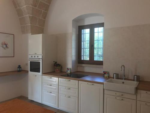 Villa Don Vito surrounded by centuries-old olive trees in Torricella