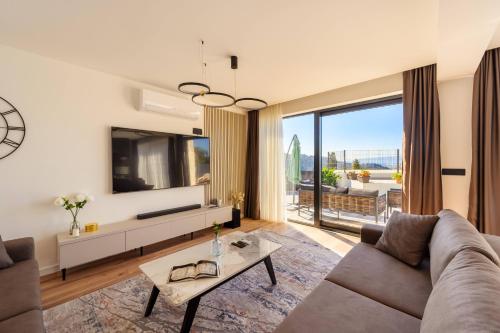 Koplietošanas atpūtas telpa ar TV, Luxury Villa San Rocco in Desne
