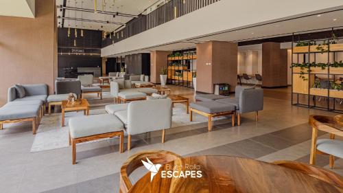 Lobby, Luxury 2-3BR Apartments - King Bed, Pool, Gym & Free Parking in Zone 11