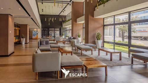 Lobby, Luxury 2-3BR Apartments - King Bed, Pool, Gym & Free Parking in Zone 11