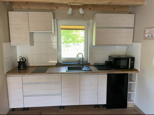 Dom wypoczynkowy Pod kasztanem 2 nad jeziorem in โรบุญ