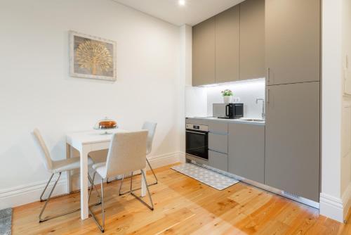 Kitchen, Plaza Apartments by HostWise in Costa