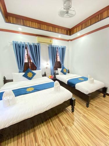Deluxe Triple Room room in Luangprabang Singharat Place 2