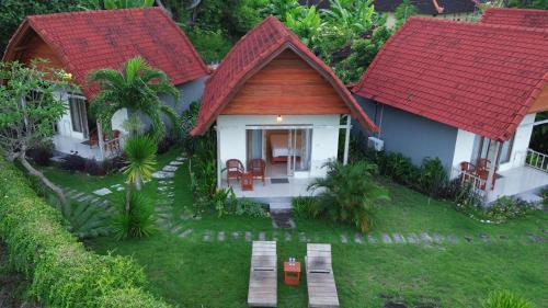 Mesari Cottage Room Type - Deluxe Bungalow with Sea View Mesari Cottage Room Type - Deluxe Bungalow with Sea View