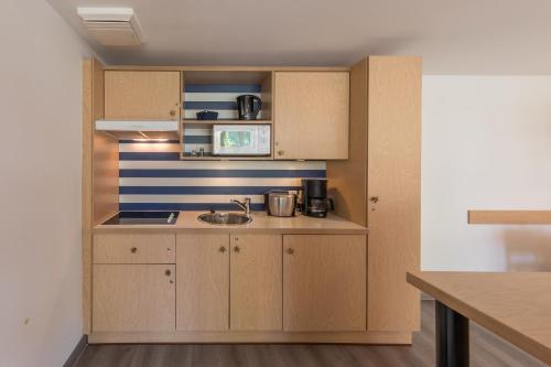 廚房, Ferienwohnung Seebär an der Seebrücke Zingst - ruhig gelegen mit Terrasse (Ferienwohnung Seebar an der Seebrucke Zingst - ruhig gelegen mit Terrasse) in 青斯特