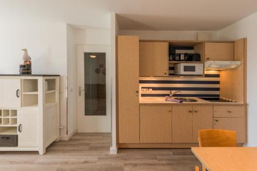 מטבח, Sturmmöwe - Ferienwohnung direkt an der Ostsee gelegen (Sturmmowe - Ferienwohnung direkt an der Ostsee gelegen) in זינגסט