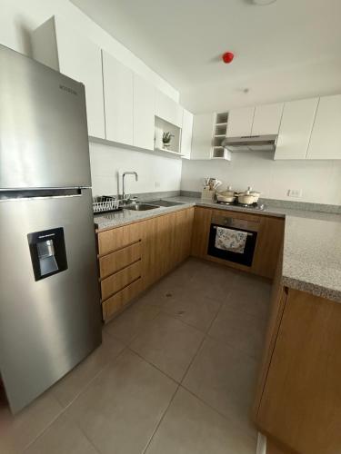 Departamento con piscina y juegos para niños