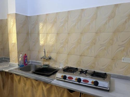 Konyha, Altamem apartment in Al-Himmah Al-Ordonyah