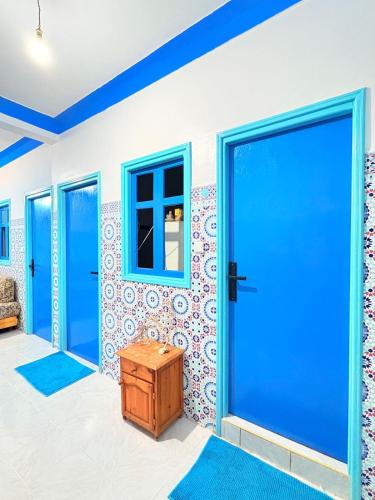 Shared lounge/TV area, Maverick Nomads Surf in Taghazout